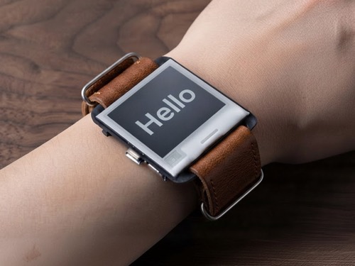 Custom e-ink watch on a wrist showing the word Hello